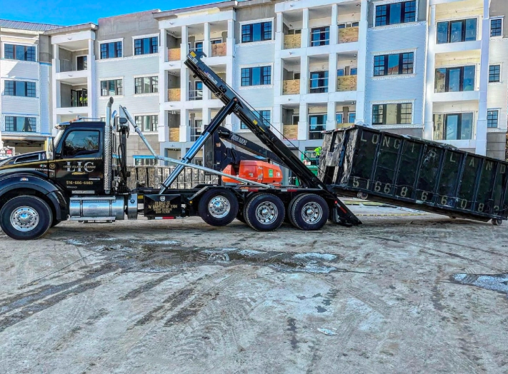 black van with a black dumpster added at the back